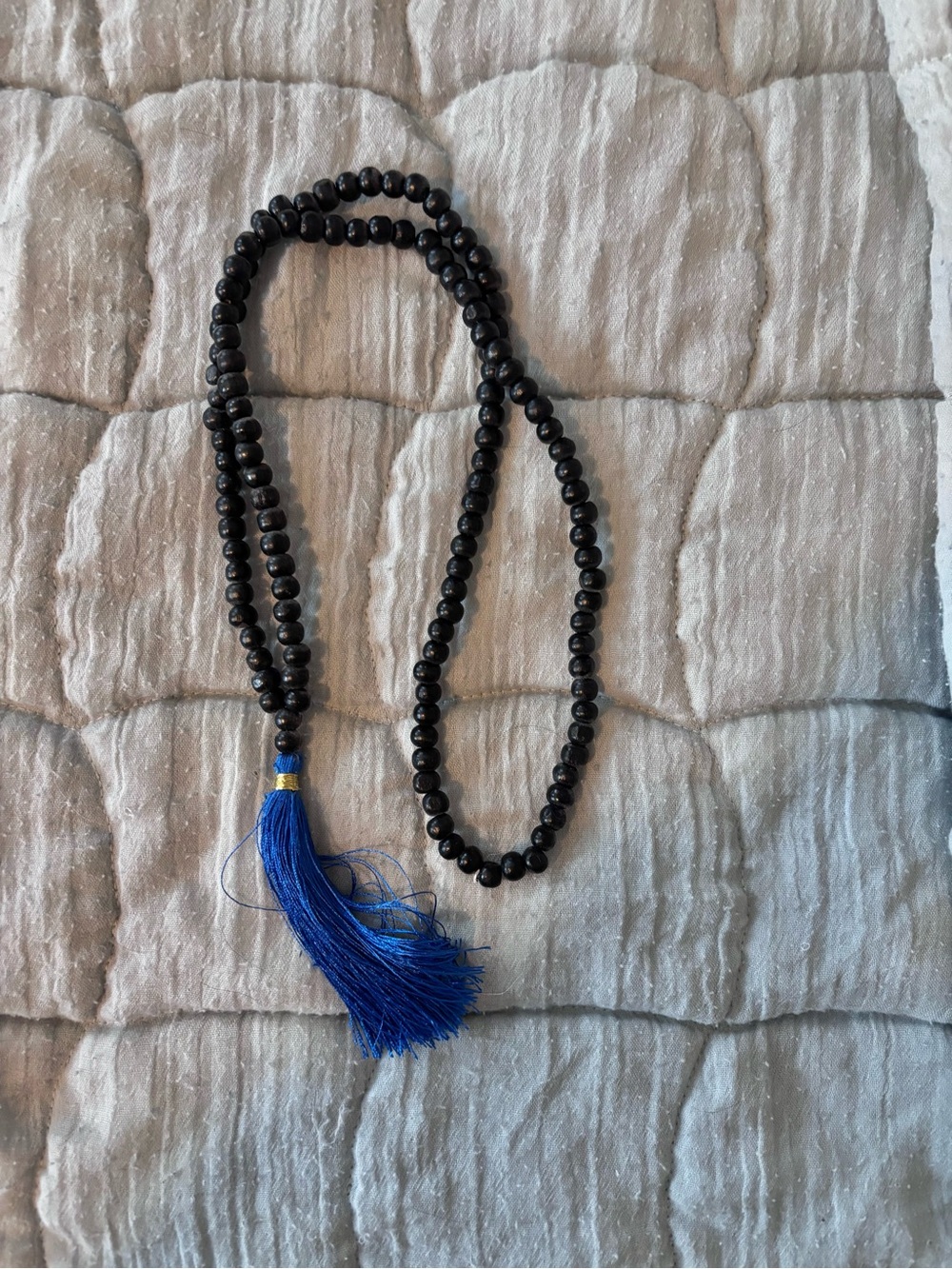 Black Beaded Necklace with Blue Tassel